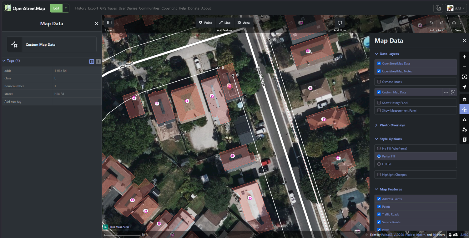 The vector layer in iD: address points with one point's tags open in the inspector panel